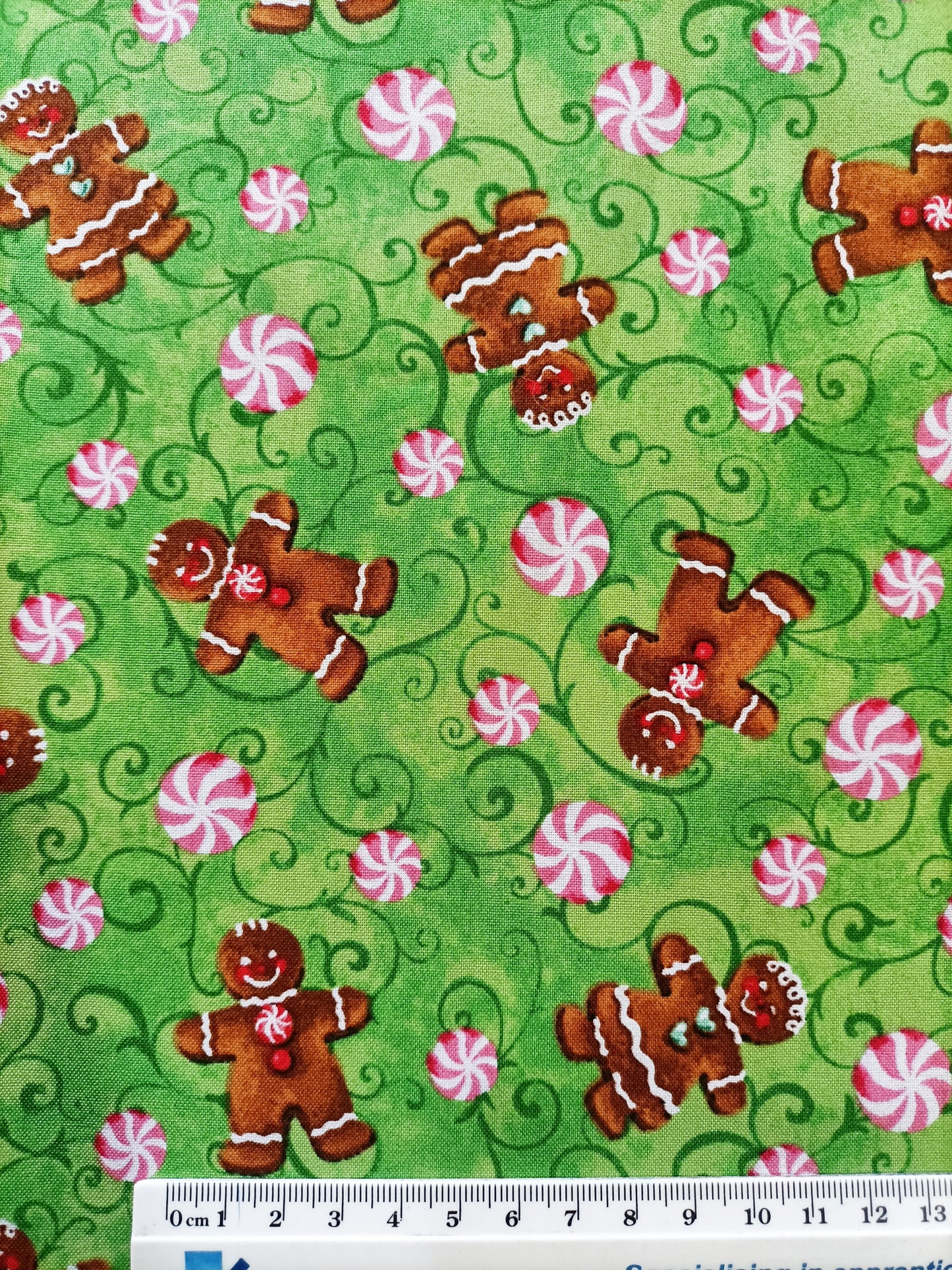 Gingerbread man cotton fabric with ruler along bottom for pattern sizing